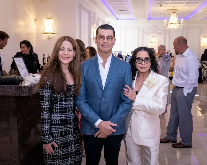 Dr. Luis Fandos with guests during the cocktail hour at the 9th Annual Beauty Ball