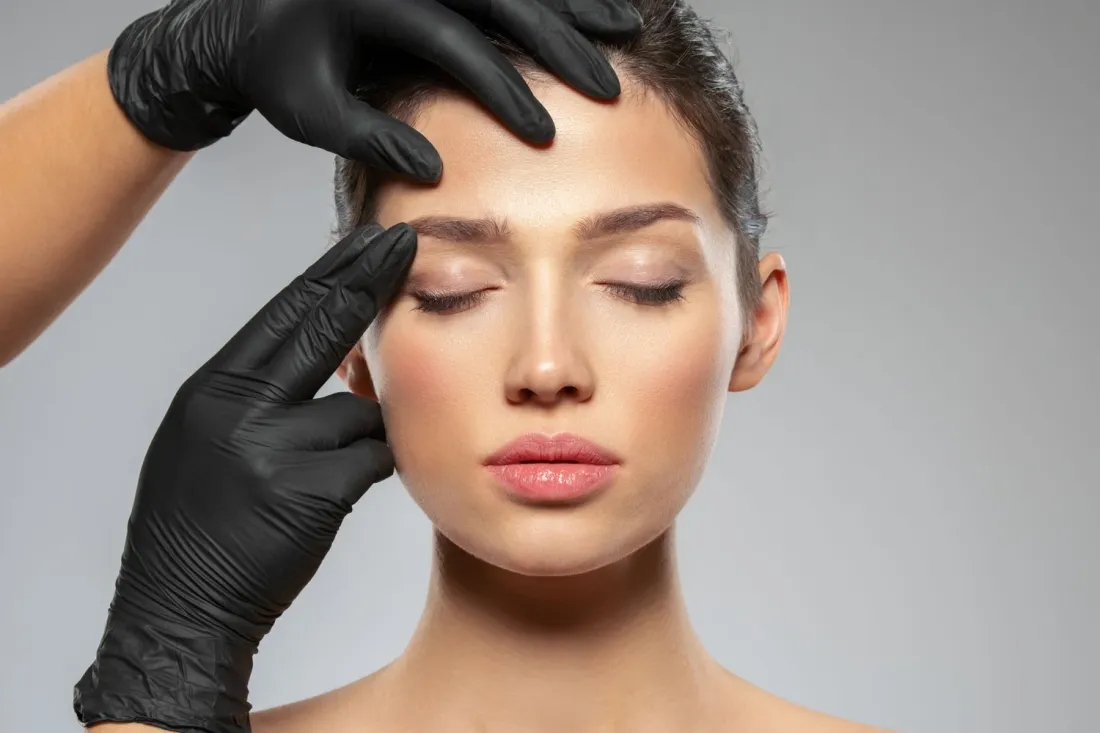A woman receiving a professional facial treatment