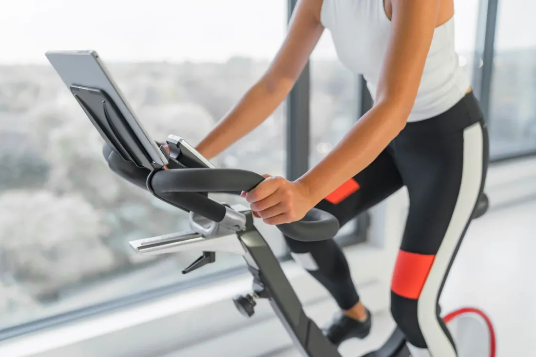 A person on a stationary bike during a metabolic assessment